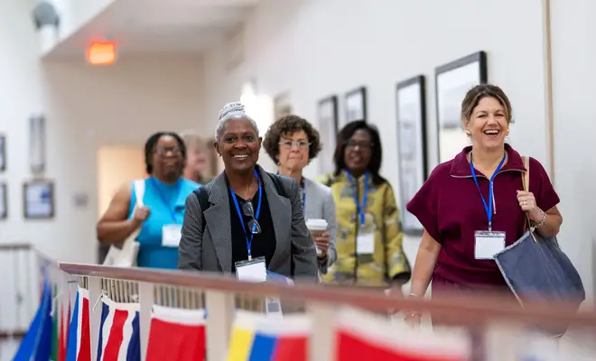 Women in Hallway entering Convening