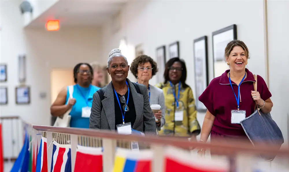 convening participants walking in